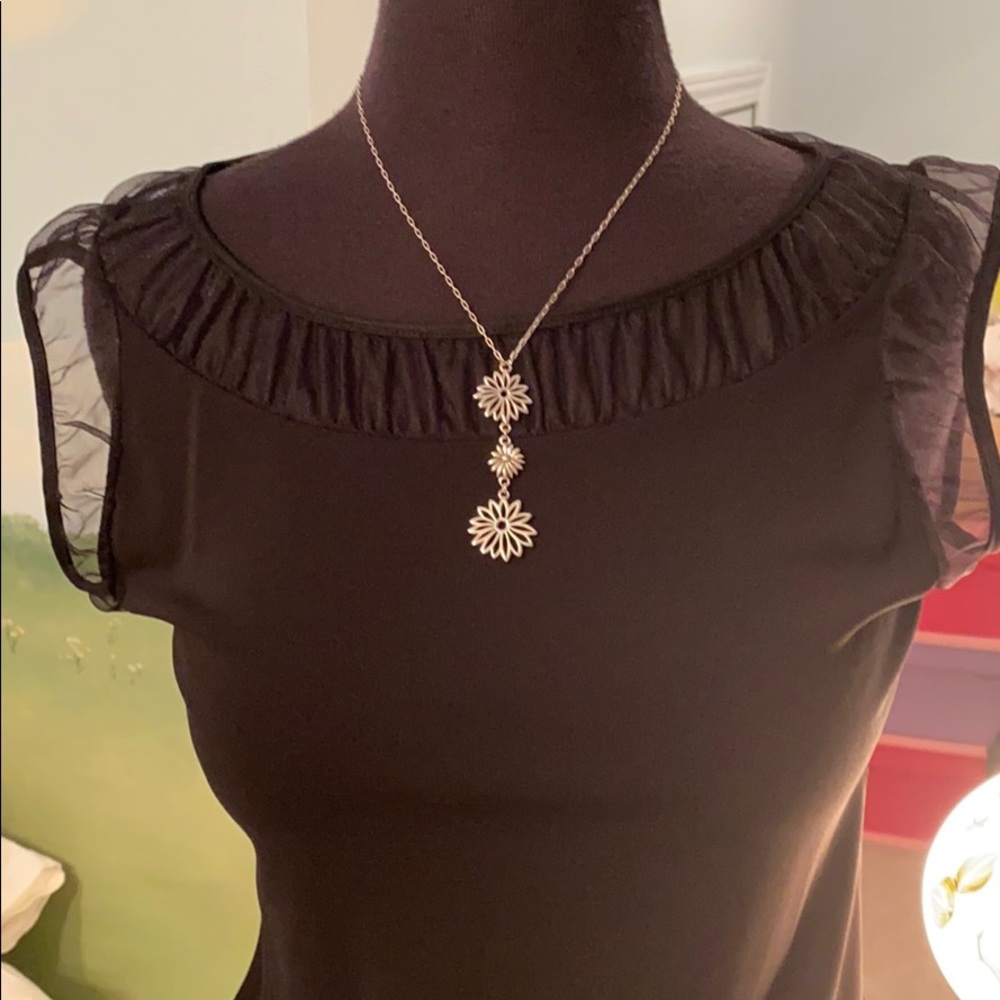 DKNY black top with sheer neckline and sleeve